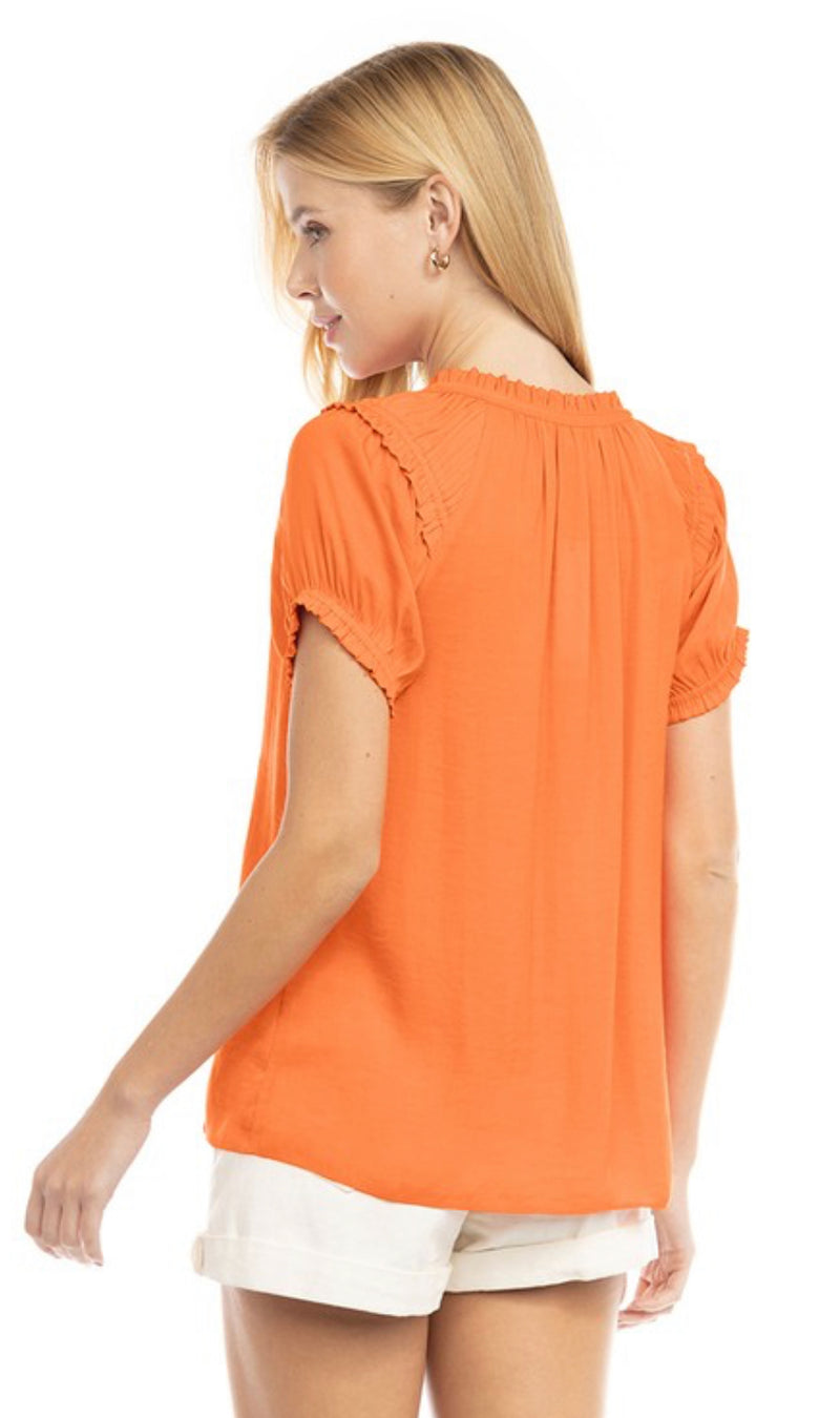 RUFFLE TRIM SPLIT NECK BLOUSE- NECTARINE